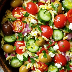 To make a tasty Mediterranean Orzo Salad, gather these fresh ingredients: - 1 cup orzo pasta - 1 cup cherry tomatoes, halved - 1 cucumber, diced (preferably seedless) - 1/2 red onion, finely chopped - 1/2 cup Kalamata olives, pitted and sliced - 1/2 cup feta cheese, crumbled - 1/4 cup fresh parsley, chopped - 1/4 cup extra-virgin olive oil - 2 tablespoons fresh lemon juice - 1 teaspoon dried oregano - Salt and freshly cracked black pepper to taste These ingredients bring bright colors and flavors to your salad. The orzo pasta acts as the base. It holds the dressing and pairs well with crisp veggies. Fresh cherry tomatoes add sweetness. Cucumbers bring crunch, while red onion gives a nice kick. Kalamata olives add depth. Feta cheese gives a creamy touch and a salty bite. Fresh parsley brightens the dish. Olive oil and lemon juice create a zesty dressing that enhances all the flavors. Dried oregano adds a hint of herbiness. Don't forget the salt and pepper to taste, as they will balance the flavors perfectly. For the full recipe, check out the steps that follow. - Bring water to a boil in a large pot. - Add 1 cup of orzo pasta and cook until al dente, about 8-10 minutes. - Drain the pasta in a colander and rinse under cold water to stop cooking. - In a large mixing bowl, mix 1 cup of halved cherry tomatoes, 1 diced cucumber, 1/2 finely chopped red onion, and 1/2 cup of sliced Kalamata olives. - Gently combine these ingredients to avoid bruising the tomatoes. - In a small bowl, whisk together 1/4 cup of extra-virgin olive oil, 2 tablespoons of fresh lemon juice, 1 teaspoon of dried oregano, and a pinch of salt and pepper. - This dressing will add bright flavors to your salad. - Add the cooled orzo to the bowl with the vegetables. - Drizzle the dressing over the salad and gently toss everything to coat evenly. - Carefully fold in 1/2 cup of crumbled feta cheese. - Make sure to spread the cheese throughout without mashing it. - Cover the bowl with plastic wrap or a lid. - Refrigerate for at least 30 minutes to let the flavors blend. Follow these steps, and you will create a delicious Mediterranean Orzo Salad. You can find the full recipe in the initial section. Enjoy! For the best presentation, use a large, shallow bowl. This allows the vibrant colors of the Mediterranean Orzo Salad to shine. Garnish with fresh parsley and a few whole olives for a nice touch. Drizzle extra olive oil on top just before serving. This adds a shiny look and boosts flavor. To add extra zest, squeeze more lemon juice over the salad before serving. Fresh herbs like basil or mint can also brighten the flavor. If you want a little kick, add a pinch of red pepper flakes. This gives a nice heat without overpowering the dish. You can prepare this salad in advance for events. Just mix all the ingredients, but hold off on adding the feta until right before serving. This keeps the cheese fresh and intact. Store leftovers in an airtight container in the fridge. They will taste great for up to three days. {{image_4}} You can boost your Mediterranean orzo salad by adding proteins. Grilled chicken adds a nice flavor and texture. Simply slice cooked chicken breast and mix it in just before serving. Shrimp is another great choice. Toss shrimp on the grill or sauté them in olive oil. They cook quickly and add a fresh taste. If you prefer a vegetarian option, try chickpeas. Canned or cooked chickpeas work well. They add protein and a creamy texture. Just fold them into the salad with the other veggies. You can customize this salad with different herbs and veggies. Fresh basil and mint add bright flavors. Try adding bell peppers for a sweet crunch. You can also toss in artichokes for an extra kick. Zucchini is another great veggie choice, either raw or roasted. Cheese is key in Mediterranean dishes. Feta is classic, but you can use goat cheese for a tangy twist. Parmesan or mozzarella also work well if you want a milder flavor. Just crumble or slice it into the salad. The dressing can change the whole dish. The classic Mediterranean dressing uses olive oil and lemon juice. You can add garlic for a stronger taste. A splash of balsamic vinegar also gives it depth. For a creamy version, mix Greek yogurt with olive oil and lemon juice. Add herbs like dill or parsley for extra flavor. This creamy dressing pairs well with the veggies and orzo, making each bite rich and satisfying. To keep your Mediterranean Orzo Salad fresh, store it in an airtight container. This helps prevent moisture loss and keeps flavors intact. Always let the salad cool to room temperature before sealing. This step stops condensation. Keep it in the fridge for up to three days. For the best taste, enjoy it within the first two days. Can Mediterranean Orzo Salad be frozen? Yes, but with care. Freezing changes the texture of fresh veggies. If you want to freeze it, consider omitting the cucumbers and tomatoes first. They do not freeze well. Instead, you can add these fresh after thawing. To freeze, place the salad in a freezer-safe container. Leave some space at the top as it expands. When ready to eat, thaw it in the fridge overnight. After thawing, mix in fresh vegetables and feta for the best flavor. You can keep Mediterranean Orzo Salad in the fridge for about 3 to 5 days. Store it in an airtight container to keep it fresh. The flavors get better as it sits, but be careful of any sogginess. If you notice the veggies losing their crunch, it's time to eat it up! Yes, you can make this salad gluten-free! Instead of orzo, use gluten-free pasta. Many brands offer excellent gluten-free options that taste great. You can also use quinoa for a nutty flavor and a healthy twist. If you want to replace feta cheese, try using goat cheese or ricotta. Goat cheese adds a tangy taste and creamy texture. Ricotta is mild and smooth, making it a good choice too. For a non-dairy option, use crumbled tofu mixed with lemon juice and herbs for flavor. To enhance the dish for meal prep, store the salad in separate containers. Keep the dressing in a small jar to mix in later. This helps maintain the salad's freshness. You can also add grilled chicken or chickpeas for protein on serving days. Yes, Mediterranean Orzo Salad can be vegan-friendly! Simply leave out the feta cheese or use a plant-based cheese. Ensure the dressing contains no honey or other animal products. This way, everyone can enjoy the fresh and vibrant flavors! For the full recipe of this delightful dish, check out the [Full Recipe]. Mediterranean Orzo Salad is fresh, easy, and full of flavor. You learned about key ingredients, step-by-step preparation, and how to store it. Remember to chill the salad for best flavor. You can also customize it with proteins or herbs for a personal touch. This dish is perfect for events or meal prep. Try it out to enjoy a burst of Mediterranean taste today!