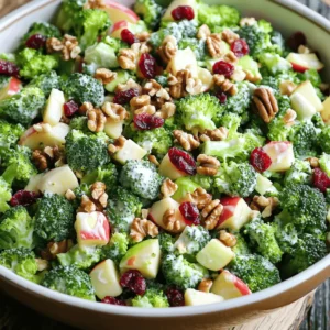 To make this Honeycrisp Apple Broccoli Salad, you need: - 2 cups fresh broccoli florets - 1 large Honeycrisp apple, diced into bite-sized pieces - 1/2 cup dried cranberries - 1/2 cup walnuts, roughly chopped - 1/4 cup red onion, finely diced These ingredients bring bright colors and flavors to your dish. You can add some fun extras to enhance your salad. Here are some ideas: - Shredded carrots for crunch - Feta cheese for creaminess - Sunflower seeds for a nutty flavor - Cooked bacon bits for a savory touch Feel free to mix and match based on what you love or have at home. The dressing ties everything together. For the creamy dressing, gather: - 1/2 cup creamy Greek yogurt - 2 tablespoons golden honey - 1 tablespoon apple cider vinegar - Salt and pepper, to taste Whisk these ingredients together until smooth. This dressing adds a sweet and tangy kick, making the salad truly special. For the full recipe, check out the detailed instructions. Start by rinsing the broccoli florets in cold water. This helps remove any dirt. If needed, cut them into smaller pieces. Next, bring a pot of water to a rolling boil. Carefully add the broccoli florets and blanch them for just 2 minutes. This keeps the broccoli bright and crisp. After blanching, transfer the broccoli to a bowl of ice water. This stops the cooking. Once cool, drain the broccoli well and set it aside. In a big mixing bowl, combine the diced Honeycrisp apple, blanched broccoli, dried cranberries, chopped walnuts, and diced red onion. Gently stir the mixture together. Make sure each ingredient is evenly distributed. This creates a great base for your salad. Take a small mixing bowl and whisk together the creamy Greek yogurt, golden honey, and apple cider vinegar. Add a pinch of salt and a dash of pepper. Keep whisking until the dressing is smooth. Taste it and adjust the seasoning if you like. The dressing should balance the sweetness of the apple and the tartness of the cranberries. Now, pour the dressing over your salad mixture. Use a gentle folding motion to combine everything. Make sure every piece of the salad is covered in the creamy dressing. This step brings all the flavors together. To let the flavors blend, cover the bowl with plastic wrap. Place it in the fridge for at least 30 minutes. This chilling time is key for a tasty salad. When ready to serve, take it out and enjoy. For a fun touch, garnish with extra walnuts and cranberries. This adds color and crunch. For the full recipe, click here. Choose the freshest broccoli florets you can find. Look for bright green color and firm texture. For Honeycrisp apples, pick ones that feel heavy for their size. This means they are juicy and crisp. Wash all produce under cold water before use. Keeping ingredients cold helps maintain their crunch. You can easily change this salad to fit your taste. Add other fruits like pears or grapes for a twist. Try different nuts, such as pecans or almonds, for varied flavors. If you prefer more crunch, include celery or bell peppers. You can also swap the Greek yogurt for a vegan option like cashew cream. A pinch of salt can brighten the flavors in your salad. Consider adding spices like garlic powder or paprika for a kick. For a zesty touch, squeeze a bit of lemon juice on top. If you love sweetness, add more honey to the dressing. Adjust to your taste for the perfect balance. For the complete recipe, check out the [Full Recipe]. {{image_4}} You can add fruits based on the season. In fall, try pears or pomegranate seeds. In summer, fresh berries like strawberries or blueberries work great. The sweetness of these fruits pairs well with the Honeycrisp apple. You can mix and match to keep the flavors exciting. Each fruit adds its own twist, making the salad feel new every time. If you want to switch up the nuts, try almonds or pecans. They both add crunch and flavor. If you prefer seeds, sunflower seeds or pumpkin seeds are excellent choices. They bring a fun crunch and boost the nutrition. You can also skip the nuts and seeds if you have allergies, and the salad will still taste amazing. To make this salad vegan, swap Greek yogurt for a plant-based yogurt. You can use coconut yogurt or almond yogurt for a creamy texture. Instead of honey, maple syrup works well to keep it sweet. This way, you can still enjoy the flavor without any animal products. The salad remains fresh and delicious while meeting your dietary needs. Try these options to see what you like best! To keep your Honeycrisp Apple Broccoli Salad fresh, store it in an airtight container. This helps prevent any drying out or wilting. Make sure to chill the salad in the fridge right after serving. It stays good for up to three days. However, the apples may brown a bit over time. To slow this down, add a splash of lemon juice on top before sealing the container. I do not recommend freezing this salad. Freezing can change the texture of the apples and broccoli. The creamy dressing can also separate and become watery when thawed. If you have extra dressing, you can freeze it in ice cube trays. This way, you can use it later for other salads. To keep your salad tasting fresh, use vibrant ingredients. Choose bright green broccoli and firm Honeycrisp apples. Store the salad separately from the dressing if you plan to eat it later. This helps maintain the crunch of the vegetables and the creaminess of the dressing. Enjoy the salad soon after making it for the best flavor and texture. For the complete recipe, check out the Full Recipe section. You can store this salad in the fridge for up to three days. To keep it fresh, use an airtight container. After a day, the apples may brown a bit. To avoid this, add some lemon juice on the apples. Yes, you can use other apples. Try Fuji or Gala for sweetness. Each type adds a unique taste. Keep in mind, the texture may change slightly based on the apple. Broccoli is full of vitamins and minerals. It helps with digestion and boosts your immune system. Apples provide fiber and antioxidants, which are great for heart health. Together, they make a tasty and healthy dish. This salad is already gluten-free! Just ensure that the ingredients, like the yogurt and honey, are gluten-free. Always check the labels to confirm they meet your dietary needs. This blog post covered how to make a delicious Honeycrisp Apple Broccoli Salad. You learned about fresh ingredients, optional add-ins, and dressing components. I provided step-by-step instructions for prepping, mixing, and serving. Tips shared will help you customize the salad for added flair. We discussed variations and best storage practices for leftovers. Enjoy experimenting with different flavors. You can make this salad your own. It’s healthy, tasty, and perfect for every meal. Dive in and enjoy!