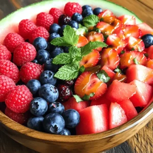 - 4 cups of seedless watermelon - 1 cup of fresh strawberries - 1 cup of blueberries - 1 cup of raspberries In this Berry Watermelon Fruit Salad, fresh fruit shines. The star is seedless watermelon. It adds sweetness and juiciness. Choose ripe, firm watermelon for the best flavor. Strawberries bring a bright red color and a tangy taste. Blueberries and raspberries add lovely pops of color and flavor. They are also packed with antioxidants. This mix creates a colorful, tasty treat. - 2 tablespoons of honey - 2 tablespoons of freshly squeezed lime juice - A pinch of fine sea salt The dressing is simple yet flavorful. Honey adds sweetness. Fresh lime juice gives a zesty kick. The pinch of sea salt enhances the flavors. Combine these ingredients for a balanced dressing that ties the salad together. - ½ cup of fresh mint leaves Fresh mint leaves make this salad special. They add a refreshing aroma and bright green color. Chop the mint finely for even distribution. This garnish elevates the salad, making it visually appealing and full of flavor. For the full recipe, check the details above. This salad is easy to make and perfect for hot days! To cut watermelon into uniform cubes, start by placing the watermelon on a stable cutting board. Cut off both ends to create flat surfaces. Then, slice the watermelon in half. Lay each half flat and cut it into long strips. Finally, slice the strips into cubes. Aim for about one-inch pieces for even bites. Next, let's hull and slice the strawberries. Hold a strawberry in one hand. Use a small paring knife to remove the green top. Then, slice the berry into thin wedges. Aim for about four to five slices per berry for a nice presentation. For washing blueberries and raspberries, place them in a colander. Rinse gently under cool water. This removes dirt without mashing the delicate berries. Let them drain while you finish preparing the other fruits. To make the dressing, combine honey and lime juice in a small bowl. Measure two tablespoons of honey and two tablespoons of lime juice. This mix adds sweetness and tang. For a smooth consistency, use a whisk. Whisk the honey and lime juice together until they blend well. The mix should look shiny and smooth. A pinch of fine sea salt brings out the flavors. It balances the sweetness and enhances the taste of the fruit. Now, let's assemble the salad. Start by mixing the prepared fruits in a large bowl. Gently fold them together to avoid mashing the berries. You want to keep them whole for a beautiful look. Next, drizzle the honey-lime dressing evenly over the fruit mix. This ensures each piece gets a taste of the dressing. Use a spatula to toss everything lightly. Incorporate the dressing without crushing the berries. To finish, sprinkle finely chopped mint leaves over the top. The mint adds a fresh aroma and a pop of color. Toss the salad one more time to mix the mint in evenly. For the best flavor, cover the bowl and chill it in the fridge for at least 15 minutes. This waiting time lets the flavors meld beautifully, making each bite a refreshing delight. Enjoy your Berry Watermelon Fruit Salad! For the best taste, chill your salad for at least 15 minutes. This lets the flavors blend well. If you want it sweeter, add a little honey to the dressing. You can also taste it before serving. Adjust the sweetness based on your preference. Choose a clear glass bowl for serving. This lets everyone see the colorful fruits inside. For a decorative touch, garnish with extra mint leaves on top. You can also sprinkle a few berries around the edge for a pop of color. To keep your salad fresh, store it in an airtight container. Place it in the fridge and eat within two days. If you have leftovers, try to keep the mint separate until serving. This helps it stay fresh and vibrant. {{image_4}} You can add a fun twist to your Berry Watermelon Fruit Salad by including tropical fruits. Try adding fresh pineapple or ripe mango. Both fruits add sweetness and a lovely texture. Pineapple gives a nice tartness, while mango adds a creamy feel. You can also sprinkle coconut flakes on top. This adds a crunchy texture and a tropical flair. Berries are the stars of this salad, but you can mix it up! Swap in blackberries or strawberries for a new flavor. You can use whatever is fresh and in season. Seasonal fruits like peaches or cherries can add a tasty surprise. The different berry combinations keep the salad exciting and fresh. The dressing can change the whole salad. Instead of honey, try using agave nectar. It’s a great option for those who want a vegan choice. For a zesty kick, use citrus juice like orange or grapefruit. This gives the salad a bright and refreshing taste. Just remember, the dressing ties all the flavors together in this fruit salad. Check out the Full Recipe for more details! Watermelon is mostly water, which means it keeps you hydrated. It has vitamins A and C, plus antioxidants. These help your skin and immune system. Watermelon is low in calories. That makes it a great snack! Berries are a superfood. Strawberries, blueberries, and raspberries are loaded with vitamins and fiber. They help your heart and boost brain health. Mint adds a fresh flavor and may help with digestion. Together, these ingredients make this salad not just tasty, but good for you too! Each serving of Berry Watermelon Fruit Salad has about 100 calories. Most of these calories come from the fruit. The sugar in fruit is natural and gives you energy. It’s different from added sugars in snacks. Eating whole fruits, like berries and watermelon, is a smart choice. This salad is perfect for many diets. It is gluten-free, making it safe for those with gluten issues. It is also vegan-friendly. You can enjoy this refreshing dish no matter your diet! To keep your Berry Watermelon Fruit Salad fresh, store it in an airtight container. This helps to lock in moisture and flavor. You can keep it in the fridge for up to 3 days. However, the berries may lose some texture over time. To keep them firm and juicy, eat the salad within 24 hours if possible. Yes, you can make this salad ahead of time! Prepare all the fruits and mix them together. However, I recommend adding the dressing just before serving. This keeps the fruit crisp and bright. If you make it a few hours early, keep it chilled in the fridge to let the flavors blend. Feel free to add more fruits to your salad! Consider including: - Pineapple chunks for extra sweetness - Kiwi slices for a tangy kick - Grapes for added crunch - Mango for a tropical twist These fruits can make your salad even more colorful and delicious. Mix and match based on your taste! This fruit salad is easy and refreshing. We covered the ingredients, from fresh fruits to a simple dressing. You learned how to prepare, mix, and serve the salad perfectly. Don't forget the tips on enhancing flavor and storing leftovers. Feel free to add new fruits or change the dressing to fit your taste. Enjoy making this healthy treat anytime!