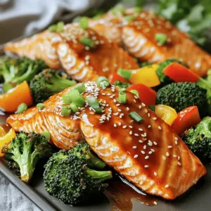 - 4 salmon fillets - 2 cups broccoli florets - 1 bell pepper, thinly sliced - 1 tablespoon olive oil - 1/4 cup low-sodium soy sauce - 2 tablespoons honey or maple syrup - 1 tablespoon rice vinegar - 2 cloves garlic, finely minced - 1 teaspoon fresh ginger, finely grated - Sesame seeds (for garnish) - Fresh green onions, chopped (for garnish) - Salt and black pepper (to taste) The key to this dish lies in the balance of flavors. The salmon fillets shine with a sweet and savory teriyaki sauce. The broccoli and bell pepper add freshness and crunch. You can use any color of bell pepper for fun! The teriyaki sauce combines soy sauce, honey, rice vinegar, garlic, and ginger. This mix creates a rich flavor that blends perfectly with the fish. I always opt for low-sodium soy sauce. It helps keep the dish light and bright. Don't forget to garnish your plate! A sprinkle of sesame seeds and chopped green onions makes everything pop. This dish is not only tasty but also colorful. It will surely impress your family or guests. Make sure to measure your ingredients carefully. Using fresh, high-quality items enhances the final taste. Enjoy the cooking process and be proud of your vibrant teriyaki salmon and broccoli sheet pan! - Oven Preheating: First, preheat your oven to 400°F (200°C). This step is key for even cooking. - Lining the Baking Sheet: Next, line a baking sheet with parchment paper. This will make cleanup so much easier. - Combining Ingredients: In a small bowl, mix the low-sodium soy sauce, honey or maple syrup, rice vinegar, minced garlic, and grated ginger. Whisk until everything blends well. This sauce adds a sweet and savory kick to your dish. - Placing Salmon on the Baking Sheet: Set the salmon fillets on one side of the baking sheet. Season each fillet with salt and black pepper, then brush them with your teriyaki sauce. - Preparing Broccoli and Bell Pepper: On the other side, place the broccoli florets and sliced bell pepper. Drizzle with olive oil and sprinkle with salt and black pepper. Pour any leftover teriyaki sauce over them. Toss gently to coat. - Cooking Time and Temperature: Put the sheet pan in the oven. Bake for 15-20 minutes. The salmon should flake easily when done. - Checking for Doneness: Make sure the broccoli is tender but still bright green. This means it's cooked just right. After baking, let the dish rest for a few minutes. Enjoy the colorful, tasty meal! How to Ensure Salmon is Flaky To ensure your salmon is flaky, cook it to the right temperature. Aim for 145°F (63°C) to get that perfect texture. Avoid overcooking, as it can dry out your fish. To test, gently poke the salmon with a fork. If it flakes easily, it’s ready! Tips for Broccoli Texture For broccoli, keep it bright and crisp. Blanching it in boiling water for one minute before baking helps maintain its color and crunch. When you season it, use just enough oil to coat. This keeps the broccoli tender but not soggy. Additional Marinades You can switch up your teriyaki sauce. Try adding orange juice or pineapple juice for a fruity twist. A splash of sriracha can give it a nice kick if you like heat. Experimenting with different flavors can make the dish your own. Spice Variations Don’t be afraid to spice things up! Add red pepper flakes for heat or sesame oil for a nutty flavor. Fresh herbs like cilantro or basil can add freshness. Use your favorite spices to create new layers of flavor in this simple dish. {{image_4}} You can switch up the protein in this dish. Chicken or tofu works great. If you choose chicken, use boneless, skinless thighs or breasts. Cut the chicken into similar sizes as the salmon. This way, everything cooks evenly. For tofu, use firm or extra-firm tofu. Press it to remove excess water, then cube it. Marinate the chicken or tofu in the teriyaki sauce for at least 30 minutes. This adds deep flavor and keeps your meal juicy. Feel free to mix in other veggies. Carrots, snap peas, or zucchini add great colors and textures. You can also use mushrooms for an earthy taste. Just chop them into bite-sized pieces. Toss these vegetables with your teriyaki sauce for extra flavor. Be mindful of cooking times. Some veggies may need a bit more time while others cook quickly. Always cut them into similar sizes for even cooking. This way, each bite is packed with deliciousness. Store leftovers in an airtight container. This keeps the teriyaki salmon and broccoli fresh. You can place the leftovers in the fridge for up to three days. For longer storage, freeze them. Use freezer-safe bags or containers. This can keep the dish good for up to three months. Just remember to label the bags with the date. When reheating, aim for a gentle method. Use the oven or microwave, but avoid high heat. For the oven, preheat it to 350°F (175°C). Place the salmon and broccoli on a baking sheet. Heat for about 10-15 minutes. This keeps the flavors strong and the salmon moist. If using a microwave, cover the dish to keep moisture in. Heat in 30-second bursts until warm. Enjoy the tasty dish just like the first time! Yes, you can use both fresh and frozen salmon. Fresh salmon has a rich flavor and is easy to cook. Frozen salmon is more convenient and can be just as tasty. Thaw frozen salmon in the fridge overnight for best results. This recipe can be gluten-free. Just use gluten-free soy sauce or tamari instead of regular soy sauce. Check all labels to be sure. This way, you can enjoy teriyaki salmon without gluten. Yes, you can make teriyaki sauce at home. Combine low-sodium soy sauce, honey or maple syrup, rice vinegar, minced garlic, and grated ginger. This mix gives a tasty sauce that’s better than store-bought. Adjust sweetness to match your taste. You can serve teriyaki salmon and broccoli with rice or quinoa. These grains soak up the sauce well. You might also add a simple salad or steamed rice for extra texture. Serve the meal hot for the best flavor. This blog shows how to make a tasty teriyaki salmon dish with broccoli and bell pepper. You learned how to prepare the oven, make the sauce, and arrange the food. We also shared tips for cooking and storing leftovers. The recipe is flexible, allowing choice of protein and veggies. In closing, this dish is simple and fun. You can impress your family and friends with it. Try different flavors to make it your own. Cooking should be enjoyable, and this meal is an easy way to start!