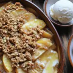 - 4 medium apples, peeled, cored, and thinly sliced - 1 tablespoon fresh lemon juice - 1 teaspoon ground cinnamon - 1/2 teaspoon ground nutmeg - 1/2 cup packed brown sugar, divided - 1 cup rolled oats - 1 cup all-purpose flour - 1/2 cup unsalted butter, cold and cut into small cubes - 1/2 cup chopped pecans or walnuts (optional for extra crunch) - Pinch of salt - Vanilla ice cream - Freshly whipped cream - Garnishes like cinnamon and nuts The main ingredients give this treat its rich taste. Start with apples. I prefer tart apples like Granny Smith. They balance well with the sweet topping. The lemon juice keeps the apples fresh and bright. You’ll want the cinnamon and nutmeg for warmth. They add a cozy feel. The optional ingredients make the crisp even better. Rolled oats give a hearty texture. The all-purpose flour helps bind the topping. Cold butter is key; it helps create that crumbly topping we love. Chopped nuts add a nice crunch, but they are not a must. Serving this dish is fun. I love it warm with a scoop of vanilla ice cream. The cold ice cream melts into the warm crisp. It creates a delightful contrast. Freshly whipped cream is another great option. For a little extra flair, add a sprinkle of cinnamon or some nuts on top. This dish is not just a dessert; it's a warm hug in a bowl. First, preheat your oven to 350°F (175°C). This step is key for even baking. Next, prepare your 9x13 inch baking dish. Lightly grease it with butter or cooking spray. This will help the crisp come out easily. In a large bowl, combine 4 medium apples. Peel, core, and slice them thin. Add 1 tablespoon of fresh lemon juice to the apples. This helps keep them fresh and bright. Now, sprinkle in 1 teaspoon of ground cinnamon, 1/2 teaspoon of ground nutmeg, and 1/4 cup of brown sugar. Toss the apples gently until they are fully coated. Transfer this sweet mixture to your greased baking dish. Spread it out evenly. In another bowl, mix 1 cup of rolled oats, 1 cup of all-purpose flour, and the remaining 1/4 cup of brown sugar. If you like extra crunch, add 1/2 cup of chopped pecans or walnuts. Don’t forget a pinch of salt for flavor. Stir everything together until well mixed. Now, take 1/2 cup of cold unsalted butter, cut into small cubes. Add this to your oat mixture. Use a pastry cutter or your fingers to blend until it’s crumbly. You want small lumps about the size of peas. Once the topping is ready, sprinkle it evenly over the apple mixture in your baking dish. Make sure to cover the apples completely. Place your baking dish in the preheated oven. Bake for 30-35 minutes. Check for doneness by looking for a golden brown topping. The apples should be bubbling, filling your kitchen with a sweet aroma. When done, remove it from the oven and let it cool for a few minutes before serving. Enjoy the warm, cozy flavors of your oatmeal streusel apple crisp! For a great apple crisp, choose the right apples. I suggest using Granny Smith or Honeycrisp. These apples provide a nice balance of tartness and sweetness. They also hold up well when baked. Using lemon juice is key. It adds brightness and helps the apples keep their color. Just one tablespoon is enough to enhance the flavor. Toss it with the apples before mixing in the spices. For the topping, make it crumbly. You can use a mix of oats and flour. If you want extra crunch, add chopped pecans or walnuts. This gives your crisp a satisfying texture. Avoid mushy apples by slicing them thinly. This helps them cook evenly and keeps them firm. Mixing them with sugar and spices before baking also helps them hold their shape. Serve your oatmeal streusel apple crisp warm for the best taste. I like to dish it out in individual bowls. Top each serving with a scoop of vanilla ice cream or a dollop of whipped cream. You can also sprinkle a bit of cinnamon on top for added flavor. Chopped nuts make a nice garnish, too. These simple touches make your dessert look and taste even better. {{image_4}} To elevate the taste of your oatmeal streusel apple crisp, consider adding spices. A dash of allspice or ginger can bring warmth. You might also enjoy a hint of vanilla extract for a sweet twist. If you want to use alternative sweeteners, try maple syrup or honey instead of brown sugar. They add a unique flavor and can make the dish healthier. For gluten-free options, simply replace all-purpose flour with almond flour or a gluten-free blend. This swap keeps the taste while catering to dietary needs. If you need nut-free adjustments, skip the pecans or walnuts. You can use seeds like pumpkin or sunflower seeds for crunch without the nuts. During fall, mix in pears or cranberries with your apples for a festive touch. In summer, try peaches or berries for a refreshing crisp. For holiday-inspired recipes, add spices like nutmeg and cloves. You can also layer in some dried fruits, such as raisins or cranberries, for a burst of flavor. To store your leftover oatmeal streusel apple crisp, use an airtight container. Glass or plastic containers work well. Make sure to cool the crisp completely before sealing it. This helps prevent moisture buildup. Place the container in the fridge. It will keep fresh for up to four days. You can freeze apple crisp for longer storage. First, let it cool completely. Then, wrap it tightly in plastic wrap or aluminum foil. Place it in a freezer-safe bag or container. Label it with the date. It can last up to three months in the freezer. When you’re ready to eat it, thaw it in the fridge overnight. Reheat in the oven at 350°F until warm. Apple crisp is best enjoyed fresh. However, it lasts for a few days in the fridge. After four days, check for signs of spoilage. Look for any off smells or unusual textures. If you see any mold, it’s best to toss it. Always trust your senses when it comes to food safety. I love using a mix of sweet and tart apples. Good choices include: - Granny Smith: Tart and firm, great for baking. - Honeycrisp: Sweet with a nice crunch. - Fuji: Juicy and sweet, adds great flavor. Using different apple types gives your crisp depth. Each bite can surprise you with a new taste. Yes, you can prepare this dish ahead. Here are some tips: - Slice your apples and toss them with lemon juice. This keeps them fresh. - Mix the streusel topping and store it in the fridge. - Combine everything just before baking. This keeps it crisp. Making it ahead saves time and lets the flavors blend. Check for a few key signs: - The topping should be golden brown. - The apples should be bubbling. - A fork should easily pierce the apples. These signs show your crisp is ready to enjoy! Absolutely! If you want to swap oats, try these options: - Almond flour: Adds a nutty flavor. - Crushed nuts: For crunch and richness. - Coconut flakes: Brings a tropical twist. These substitutes change the texture but still taste great! This blog post covered the key ingredients and steps to make a delicious apple crisp. We explored both main and optional ingredients for added flavor and texture. You also learned tips to achieve the perfect crisp and variations to suit your taste. Whether storing leftovers or making adjustments for dietary needs, you now have the tools to succeed. Enjoy the warmth of homemade apple crisp with your favorite toppings. It’s a treat that never fails to delight!