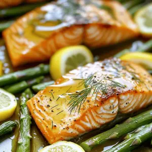- 4 salmon fillets - 1 bunch asparagus, trimmed - 3 tablespoons Dijon mustard - 2 tablespoons honey - 2 tablespoons olive oil (plus extra for drizzling) - 2 cloves garlic, finely minced - Zest and juice of 1 large lemon - Sea salt and freshly cracked pepper to taste - Fresh dill or parsley sprigs for garnish For this dish, I like to use fresh salmon fillets. Look for bright, firm fish, as it tastes better. The asparagus should be vibrant green, and the tips should be tightly closed. This ensures freshness and flavor. The Dijon mustard adds a nice tang. Honey balances it with sweetness. Olive oil keeps everything moist. Garlic brings in a savory kick. Lemon zest and juice add brightness. Finally, the sea salt and pepper enhance all flavors. Using fresh herbs like dill or parsley adds a pop of color. It also brings in a fresh taste. You can use these herbs as a final touch. They make the dish look pretty and inviting. Keep these ingredients ready, and you will create a tasty Lemon Dijon Salmon with Asparagus. Start by setting your oven to 400°F (200°C). This heat cooks the salmon and asparagus evenly and quickly. In a medium bowl, mix together: - 3 tablespoons Dijon mustard - 2 tablespoons honey - 2 tablespoons olive oil - 2 cloves garlic, minced - Zest and juice of 1 lemon Whisk these ingredients until smooth. This glaze adds a burst of flavor. Take your salmon fillets and season them with: - Sea salt - Freshly cracked pepper Make sure to season both sides. Place the fillets in a greased baking dish, skin side down if needed. Next, take the glaze and spread it evenly over the top of each fillet. Trim the asparagus and nestle it around the salmon in the baking dish. Drizzle some olive oil over the asparagus and sprinkle with sea salt and pepper. This helps the asparagus stay fresh and tasty. Put the baking dish in your preheated oven. Bake for 12-15 minutes. You know it's done when the salmon flakes easily with a fork, and the asparagus is tender but bright green. After baking, let the dish rest for about 3 minutes. This resting time makes the texture better. Garnish with fresh dill or parsley. This adds color and a fresh taste right before serving. How to choose quality salmon When picking salmon, look for bright, shiny skin. The flesh should feel firm and spring back when pressed. Avoid fish with any brown spots or a strong fishy smell. If possible, buy wild-caught salmon for better flavor and health benefits. Identifying fresh asparagus Fresh asparagus stalks should be bright green and firm. Check the tips; they should be closed and compact, not slimy or wilted. If the ends are dry, they may not be fresh. Look for thick spears for a juicy bite. Adjustments for thicker fillets If your salmon fillets are thicker than an inch, you may need to add a few extra minutes to your baking time. Start checking for doneness at 15 minutes. The salmon should flake easily with a fork. Cooking recommendations for perfect texture For the best texture, avoid overcooking. Salmon is perfect when it has a slight sheen and is a bit pink in the center. Use a meat thermometer; aim for 125°F (52°C) for medium-rare. Plating styles for serving To serve, arrange the salmon and asparagus on a large platter. This makes it easy for everyone to help themselves. Place the salmon in the center and surround it with asparagus for a colorful display. Adding extra lemon for brightness Squeeze fresh lemon juice over the dish just before serving. This adds a burst of flavor and makes the dish look even more inviting. Garnish with sprigs of dill or parsley for a touch of elegance. {{image_4}} You can switch up the veggies to keep things fresh. Instead of asparagus, try broccoli or green beans. Both pair well with the salmon's flavor. Carrots or zucchini can also add a nice touch. Just remember to adjust the cooking time if you choose thicker veggies. Want to spice it up? You can add herbs like thyme or basil to the glaze. A pinch of red pepper flakes adds heat and depth. You can also mix in some smoked paprika for a smoky twist. Each of these options gives the dish a unique flair. Grilling gives salmon a smoky flavor. It also creates beautiful grill marks. Just preheat the grill and cook for about six minutes per side. Baking is easier and keeps the salmon moist. You can also broil it for a crispy top. Broiling takes less time, so watch closely to avoid burning. Each method gives a different taste and texture. Try them all to find your favorite! To store leftovers properly, let the salmon cool first. Place it in an airtight container. Keep the asparagus with the salmon or in a separate container. This will help keep them fresh. Store in the fridge for up to three days. When you’re ready to enjoy leftovers, check for any off smells before eating. The best way to reheat salmon is in the oven. Preheat your oven to 350°F (175°C). Place the salmon on a baking tray. Add a splash of water or broth to help keep it moist. Cover it with foil to prevent drying. Heat for about 10-15 minutes. The salmon should be warm but not overcooked. For the asparagus, you can reheat them in a pan with a little olive oil. Yes, you can freeze Lemon Dijon Salmon! Make sure it is completely cool before freezing. Wrap each piece tightly in plastic wrap, then place it in a freezer bag. You can freeze it for up to three months. To defrost safely, move the salmon to the fridge overnight. This keeps it at a safe temperature. You can also use the defrost setting on your microwave, but be careful not to cook it. You should bake salmon for about 12 to 15 minutes. Check for doneness by using a fork to see if it flakes easily. If it does, it's ready! The salmon should be opaque and moist inside. Baking time can change based on thickness. Thicker fillets may need a few extra minutes. Always aim for that perfect flaky texture. Yes, you can use other types of fish if you like. Cod, trout, or halibut work well. These fish have similar cooking times. Adjust the baking time if your fish is thicker or thinner. You can keep the same glaze for flavor. Experimenting with different fish can bring new tastes to your table. Many sides go great with Lemon Dijon Salmon. Here are some popular options: - Roasted potatoes - Quinoa salad - Garlic mashed potatoes - Steamed broccoli - Mixed greens salad These sides complement the flavors of the salmon. You can also try a light pasta or grain dish. Feel free to mix and match based on your mood! Yes, this dish is quite healthy! Salmon is rich in omega-3 fatty acids. These fats are good for your heart and brain. Asparagus adds fiber and vitamins. The glaze uses honey and Dijon, which adds flavor without too many calories. Overall, this meal is a tasty way to eat well! This blog post covered all you need to create tasty Lemon Dijon Salmon with asparagus. You learned about the main ingredients, how to make a flavorful glaze, and tips for perfect cooking. Remember to choose fresh ingredients and consider different cooking methods for variety. Enjoy garnishing your dish and serving it with your favorite sides. With these steps, you can make a healthy, delicious meal any time. Now, get cooking and enjoy every bite!