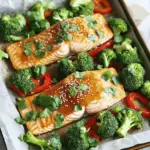 - 4 fresh salmon fillets - 1/4 cup honey - 3 tablespoons soy sauce (or tamari for a gluten-free option) First, let's start with the main ingredients. Salmon fillets are the star of this dish. They are rich in omega-3 fatty acids and taste great. You can find them fresh at your local market. Honey adds sweetness and helps create a sticky glaze. Soy sauce gives the dish a nice umami flavor. If you're gluten-free, tamari is a perfect substitute. - 3 garlic cloves, finely minced - 1 tablespoon fresh ginger, grated - 1 tablespoon extra virgin olive oil - 1 teaspoon sesame oil - Zest and juice of 1 lemon Now, we need flavor enhancers. Garlic and ginger are key here. They add a warm and spicy note. Olive oil helps to blend all the flavors, while sesame oil adds a nutty touch. Lemon zest and juice brighten the dish. They balance the sweetness of the honey and the saltiness of the soy sauce. - 2 cups bite-sized broccoli florets - 1 large red bell pepper, thinly sliced - 1 teaspoon sesame seeds (for garnish) - Fresh cilantro or chopped green onions (for garnish) For the vegetables, use broccoli florets. They add color and crunch. A red bell pepper adds sweetness and a pop of color. Garnish your dish with sesame seeds. They add a nice crunch. Fresh cilantro or green onions give a burst of freshness. These veggies make your meal not just tasty but also visually appealing. - Preheat your oven to 400°F (200°C). - Line a large baking sheet with parchment paper for easy cleanup. - In a small bowl, whisk together the honey, soy sauce, minced garlic, and grated ginger. - Add olive oil, sesame oil, lemon juice, and lemon zest. Mix until smooth. - Place the salmon fillets in the center of the baking sheet. - Lightly season them with salt and black pepper. - Arrange the broccoli and red bell pepper around the salmon. Make it colorful. - Place the baking sheet in the oven to roast for about 15-20 minutes. - Check the salmon. It should flake easily with a fork. The veggies should be tender but bright. - Once cooked, take the baking sheet out of the oven. - Sprinkle sesame seeds over the salmon and vegetables for a nice crunch. - Add fresh cilantro or green onions on top for color and flavor. To ensure your salmon is perfectly flaky, pay close attention to the cooking time. Bake the salmon for about 15 to 20 minutes at 400°F (200°C). Check it after 15 minutes. The salmon is done when it flakes easily with a fork. If you overcook it, the fish can become dry. For the vegetables, broccoli florets and sliced red bell pepper work well. They need the same cooking time as the salmon. Keep them around the fish so they soak up those tasty juices. This way, your veggies stay bright and crunchy. You can serve the salmon and veggies straight from the pan for a cozy vibe. This makes cleanup easy and keeps the flavors together. If you prefer a fancier look, plate the salmon and veggies individually. Drizzling the remaining honey garlic sauce over each portion adds an extra layer of flavor. This little touch makes your meal feel special. Plus, it looks beautiful on the plate! {{image_4}} You can change up the veggies in this dish. Instead of broccoli and red bell pepper, try zucchini or asparagus. Both add great color and taste. You can also use snap peas or carrots for a nice crunch. For sauces, you might want to switch out the honey garlic sauce. Teriyaki sauce gives a sweet and savory twist. You can also mix in some chili paste for a spicy kick! If you need a gluten-free option, use tamari instead of soy sauce. It tastes just as good and keeps the dish safe for those with gluten sensitivities. For low-carb diets, skip the honey. Use a sugar-free sweetener instead. You can also add more veggies, like cauliflower or spinach, to keep it filling without the carbs. To keep your leftovers fresh, place them in an airtight container. Store the salmon and veggies in the fridge for up to three days. If you want to keep them longer, freeze them. Wrap each portion tightly in plastic wrap or foil. Then, place them in a freezer-safe bag. This way, you can enjoy your meal later without losing flavor. When it's time to enjoy your leftovers, reheat them gently. The best method is to use an oven. Preheat your oven to 350°F (175°C). Place the salmon and veggies on a baking sheet. Cover them with foil to keep moisture in. Heat for about 10 to 15 minutes. This way, you avoid drying out the salmon, keeping it flaky and juicy. Can I use frozen salmon? Yes, you can use frozen salmon. Just make sure to thaw it first. Thaw it overnight in the fridge or use cold water for quick thawing. Cooking time may vary slightly. Always check for doneness to ensure it's safe to eat. How do I know when the salmon is done? Salmon is done when it flakes easily with a fork. It should be opaque and moist. Use a food thermometer for best results. The thickest part should reach 145°F (63°C) for safe consumption. What can I replace honey with? You can replace honey with maple syrup or agave nectar. Both will add sweetness. If you want a less sweet option, try brown sugar mixed with a bit of water. Can I use other types of fish? Yes, you can use other fish like trout or tilapia. These fish have similar cooking times. Just adjust the sauce to fit the flavor of the fish you choose. What sides go well with this dish? Serve this dish with rice, quinoa, or a fresh salad. Roasted sweet potatoes or green beans also pair well. These sides balance the meal and add more color. How to pair wines with honey garlic salmon? For wine, a light white like Sauvignon Blanc works well. If you prefer red, a light Pinot Noir can be nice too. Both wines will complement the flavors without overpowering them. This blog post covered how to make a tasty honey garlic salmon dish. We explored key ingredients like salmon, honey, and flavor enhancers such as garlic and ginger. I shared step-by-step instructions for roasting, along with tips for perfect texture and presentation. You can even customize the dish with different veggies or sauces. Storing leftovers properly keeps your meal fresh for later. With these insights, you can enjoy this dish in many ways, making it a genuine staple in your kitchen. Dive in and savor this simple yet delicious recipe!