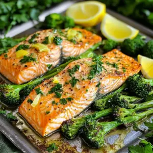 The joy of cooking starts with great ingredients. For this Sheet Pan Lemon Garlic Salmon and Broccolini, you need the following: - Salmon Fillets (4 pieces, approx 6 oz each) - Broccolini (1 bunch) - Olive Oil (3 tbsp) - Garlic (4 cloves) - Fresh Lemons (2, zest and juice) - Smoked Paprika (1 tsp) - Salt and Pepper (to taste) - Fresh Parsley (for garnish) - Lemon Wedges (for serving) Each ingredient plays a key role. The salmon brings rich flavor and healthy fats. Broccolini adds a nice crunch and bright color. Olive oil helps everything cook evenly while adding a smooth texture. Garlic gives a strong, warm taste that pairs well with lemon. The zest and juice of fresh lemons elevate the dish with a zesty punch. Smoked paprika adds depth and a hint of smokiness. Salt and pepper enhance all the flavors. Finally, parsley and lemon wedges add a fresh touch for serving. Using fresh ingredients makes a big difference in taste. I always recommend sourcing local, in-season produce. It tastes better and supports local farms. Enjoy the process of gathering these ingredients, and you will create a delightful dish. First, set your oven temperature to 400°F (200°C). This high heat will help cook the salmon and broccolini evenly. To make cleanup easy, line your baking sheet with parchment paper. This saves time and effort later. In a small bowl, combine 3 tablespoons of olive oil, 4 minced garlic cloves, and the zest and juice of 2 lemons. Add 1 teaspoon of smoked paprika, salt, and pepper to taste. Whisk all these ingredients together until they blend well. This marinade brings rich flavor to the salmon and broccolini. On one side of the baking sheet, place the salmon fillets skin-side down. Use a brush to coat each fillet generously with your marinade. On the other side, lay the trimmed broccolini in a single layer. Drizzle any leftover marinade over the broccolini. Toss it gently with your hands to coat each piece. Now, it’s time to roast! Place the baking sheet in your preheated oven. Roast for about 15 to 20 minutes. The salmon is done when it flakes easily with a fork, and the broccolini should be tender but still bright green. After cooking, take the baking sheet out of the oven. Let the dish rest for a couple of minutes. This step helps the flavors settle. Before serving, sprinkle fresh chopped parsley on top for a pop of color. Serve the salmon and broccolini with lemon wedges on the side. This adds a zesty kick and lets everyone customize their meal. Enjoy your tasty creation! To check if your salmon is done, use a fork. Flake the thickest part. If it breaks apart easily, it's ready. Salmon cooks quickly, so watch it closely to avoid overcooking. If you see white protein on top, it’s overdone. Aim for a moist and tender bite. Add the broccolini halfway through the cooking time. This ensures it stays bright and crunchy. If you put it in too early, it can become mushy. You want it tender but still vibrant and green. Using parchment paper makes cleanup a breeze. Line your baking sheet before cooking. Once you’re done, just lift off the paper and toss it away. This saves time and keeps your kitchen clean. {{image_4}} You can switch salmon for chicken or tofu. Chicken thighs work well with the same marinade. Their rich flavor pairs nicely with lemon and garlic. For a vegetarian option, use firm tofu. Just press the tofu to remove water, then cut it into cubes. Marinade each piece just like the salmon. Bake until golden and crispy. Feel free to add other veggies. Asparagus or bell peppers are great choices. Asparagus adds a nice crunch and is easy to roast. Cut the ends and toss them with olive oil like broccolini. Bell peppers bring sweetness and color. Slice them into strips and arrange them on the baking sheet. You can boost flavor with extra herbs and spices. Try fresh dill or thyme for a bright taste. A sprinkle of red pepper flakes adds heat. Or, add a touch of honey for sweetness. Mix and match to find your favorite flavor combination. These simple tweaks can make a big difference in taste. To store leftovers, let the salmon and broccolini cool. Place them in an airtight container. Make sure to keep it in the fridge. This way, the dish stays fresh for up to three days. Always label the container with the date. This helps you remember when you made it. For reheating, the best method is the oven. Preheat the oven to 350°F (175°C). Place the salmon and broccolini on a baking sheet. Cover it with foil to keep moisture in. Heat for about 10 minutes, or until warm. You can also use a microwave. Just heat in short bursts for 30 seconds. Check often to avoid drying it out. You can freeze this dish, but with some care. Wrap the salmon and broccolini tightly in plastic wrap, then place them in a freezer bag. Squeeze out air to avoid freezer burn. This dish will keep well for up to three months. For the best taste, thaw it in the fridge overnight before reheating. Cooking salmon on a sheet pan takes about 15 to 20 minutes at 400°F (200°C). Check the salmon after 15 minutes. It should flake easily with a fork. If it still feels firm, let it cook for another few minutes. Timing may vary based on the thickness of the fillets. Always keep an eye on it to avoid overcooking. Yes, you can substitute ingredients for dietary needs. If you don’t have broccolini, use asparagus or green beans. For the salmon, you can use chicken breasts or tofu for a plant-based option. If you want to skip olive oil, try avocado oil or melted butter. Adjust the garlic and lemon to match your taste. Pair this dish with rice or quinoa for a filling meal. A fresh salad adds crunch and freshness. You might also serve it with mashed potatoes or roasted sweet potatoes. If you like bread, try garlic bread or a crusty baguette to soak up the juices. This dish is quite healthy! Salmon provides omega-3 fatty acids, which are good for your heart. Broccolini is rich in vitamins A and C. The olive oil adds healthy fats. Overall, this meal is low in carbs and high in nutrients, making it a great choice for a balanced diet. This recipe gives you a simple way to prepare delicious sheet pan lemon garlic salmon. It walks you through the ingredients, step-by-step cooking, and helpful tips. You can even swap in different proteins and veggies for variety. Don’t forget about storing leftovers properly to enjoy later. Whether you’re a beginner or an expert, this dish will impress your family or friends. Enjoy making this healthy meal and feel free to experiment with flavors!