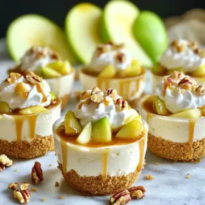 To create your Caramel Apple Cheesecake Truffle Cups, gather these ingredients: - 1 cup graham cracker crumbs - 1/2 cup unsalted butter, melted - 1 (8 oz) package cream cheese, softened - 1/2 cup powdered sugar - 1 teaspoon vanilla extract - 1 cup diced apples (I recommend Granny Smith or Honeycrisp) - 1/2 teaspoon ground cinnamon - 1/4 cup caramel sauce (store-bought or homemade) - 1/2 cup whipped cream (for topping) - Extra caramel sauce for drizzle - Chopped nuts (pecans or walnuts) for garnish When choosing ingredients, I like to use: - Graham Crackers: Nabisco Honey Maid for a classic taste. - Butter: Land O'Lakes unsalted butter for its rich flavor. - Cream Cheese: Philadelphia cream cheese for its smooth texture. - Powdered Sugar: Domino powdered sugar for its fine consistency. - Caramel Sauce: Smucker's or make your own for freshness. If you need substitutions, here are some options: - Graham Cracker Crumbs: Use crushed Digestive biscuits for a different flavor. - Unsalted Butter: Replace with coconut oil for a dairy-free option. - Cream Cheese: Use vegan cream cheese for a plant-based twist. - Powdered Sugar: Try using coconut sugar for a less processed choice. - Apples: Other fruit like pears or peaches can work well too. To start, gather your graham cracker crumbs and melted butter in a medium bowl. Mix them until they look like wet sand. This will be your base. Now, take mini cupcake liners or silicone molds and press the mixture firmly into the bottoms. You want an even crust that holds together well. Once done, place these in the refrigerator to chill while you make the filling. Next, grab a large mixing bowl and add your softened cream cheese. Beat it with an electric mixer until it is smooth. Slowly add the powdered sugar and vanilla extract while mixing. Keep going until the mixture is creamy and free of lumps. In a small bowl, toss your diced apples with ground cinnamon to coat them well. Then, gently fold the apple mixture into your creamy filling. Now that your crusts have chilled, take them out of the fridge. Use a spoon to fill each crust with the cheesecake apple mixture. Fill them about ¾ full, leaving space for toppings. This part is fun, and you can be creative with how you fill them. Once filled, drizzle caramel sauce over the tops of each cup. Let it flow down the sides for a pretty look. Now, put the filled truffle cups back in the fridge and chill for at least 2 hours. This helps the filling set properly. Just before you serve, add whipped cream on top of each cup. Finish with a drizzle of extra caramel and a sprinkle of chopped nuts for crunch. Enjoy this delightful treat! For the best cheesecake texture, always use room temperature cream cheese. It mixes better and gets creamy. Beat the cream cheese until it’s smooth before adding any sugar. This step helps avoid lumps. Make sure to fold in the apples gently. This keeps the mixture light and fluffy. If you’re short on time, use store-bought graham cracker crumbs. They save you prep time. You can also prep the crust ahead of time and chill it overnight. When you are ready to bake, just make the filling and assemble. You can chill the truffle cups while you clean up. Serve your truffle cups on a nice platter. Place them in a circle or row for a fun look. Add a few fresh apple slices around the cups for color and contrast. A sprinkle of chopped nuts on top adds texture. Don’t forget that extra caramel drizzle. It makes each cup even more tempting! {{image_4}} You can swap apples for other fruits in this recipe. Try using diced pears, peaches, or berries. Each fruit brings its own unique flavor. For example, tart cranberries add a nice zing. Sweet strawberries work well too and pair nicely with cream cheese. When choosing fruit, think about what you enjoy most. This can help make the truffle cups even more special. Caramel sauce is sweet and rich, but you have options. You can use chocolate sauce for a different taste. A fruit glaze can also work if you prefer a lighter touch. Honey or maple syrup can be great too. Each alternative changes the flavor but still tastes amazing. Experimenting with these choices makes cooking fun! To make these truffle cups gluten-free, swap graham cracker crumbs for gluten-free crumbs. Look for brands that fit your needs. For a vegan version, use plant-based cream cheese and butter. There are many excellent options now. You can also try coconut cream for a rich texture. These changes let everyone enjoy this tasty treat! To keep your truffle cups fresh, store them in an airtight container. This helps keep moisture out and prevents them from drying out. Place a layer of wax paper between the cups if stacking them. This prevents sticking and keeps their shape intact. Always store them in the fridge to keep the cream cheese filling firm. These truffle cups can last up to five days in the fridge. After that, they may lose flavor and texture. Always check for any signs of spoilage before eating. If they look or smell off, it’s best to toss them. You can freeze truffle cups for up to three months. To freeze, place them in a single layer on a baking sheet. Once frozen, transfer them to a freezer-safe container. When ready to eat, let them thaw in the fridge overnight. Avoid refreezing thawed truffle cups to keep their taste and texture. Yes, you can use a store-bought cheesecake mix. It saves time, and many brands taste great. Just follow the package directions, and mix in the diced apples and cinnamon. This swap still gives you that lovely flavor without the fuss. Making homemade caramel sauce is easy! You just need sugar, butter, and cream. Start by melting a cup of sugar in a pan over medium heat. Stir it until it turns golden brown. Then, add half a cup of butter and mix. Slowly pour in half a cup of cream. Stir until smooth. Let it cool before using. You can find pre-made truffle cups at local grocery stores or baking supply shops. Check the baking aisle or the dessert section. You can also buy them online from specialty baking websites. They often come in fun shapes and sizes. Yes, you can make these truffle cups ahead of time. Prepare them a day before your event. Just store them in the fridge until you're ready to serve. This makes your life easier and lets the flavors blend nicely! This blog covered how to make tasty cheesecake truffle cups. We talked about the best ingredients and brands, plus helpful substitutions. I shared step-by-step instructions to prepare, fill, and serve your treats. You also learned tips for great texture and quick baking. Variations showed you ways to change things up, including fruit and vegan options. Finally, I included storage tips. With this info, you can create delicious truffle cups that impress everyone. Enjoy making them!