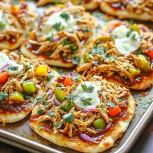 - Cooking chicken and BBQ sauce - 2 cups cooked chicken, shredded - 1 cup BBQ sauce (your favorite flavor) - Flatbreads and cheese options - 4 flatbreads (store-bought or homemade) - 1 cup shredded mozzarella cheese - Fresh vegetables and herbs - 1/2 cup red onion, thinly sliced - 1 cup bell peppers, diced (mix of red, green, and yellow) - 1/4 cup fresh cilantro, chopped - 1 teaspoon garlic powder - Salt and pepper, to taste - Olive oil, for drizzling Using these fresh ingredients makes this dish a delight. Start with cooked chicken and your favorite BBQ sauce. This mix gives the flatbreads a nice flavor. You can use store-bought flatbreads for ease or make your own for a personal touch. Next, add shredded mozzarella cheese. Its gooey texture pairs well with the BBQ chicken. For added crunch and color, include thinly sliced red onions and diced bell peppers. They bring freshness and a pop of color to your dish. Finishing with fresh cilantro adds brightness. Garlic powder, salt, and pepper enhance the flavors even more. A drizzle of olive oil on the flatbreads helps them crisp up nicely in the oven. Gather these ingredients, and you’re ready to create a tasty meal everyone will love! Start by setting your oven to 425°F (220°C). This high temperature is key for a crispy flatbread. While the oven heats, gather your ingredients. This will help you stay organized as you cook. Make sure to have everything on hand, so you can move quickly. In a medium bowl, mix 2 cups of shredded chicken with 1 cup of your favorite BBQ sauce. Stir well until the chicken is fully coated. For extra flavor, add 1 teaspoon of garlic powder, salt, and pepper to taste. Adjust the seasoning based on your preference. This mixture adds a rich, smoky taste to your flatbreads. Line a large sheet pan with parchment paper or grease it lightly. Place 4 flatbreads on the pan. Drizzle olive oil on each flatbread to enhance the flavor. Spread the BBQ chicken mixture evenly across all flatbreads. Layer the flatbreads with 1/2 cup of thinly sliced red onion and 1 cup of diced bell peppers. Finally, sprinkle 1 cup of shredded mozzarella cheese on top. Carefully place the sheet pan in your preheated oven. Bake for 12 to 15 minutes. Keep an eye on them. Look for melted, bubbly cheese and crispy edges. Once done, take the pan out and sprinkle chopped cilantro on top for a fresh finish. Slice each flatbread into quarters for easy serving. Enjoy your delicious creation! To make the best flatbreads, start with a drizzle of olive oil. This helps create a golden, crispy crust. Use a brush to spread the oil evenly. An even layer of oil ensures all parts of the flatbread cook well. Next, pay attention to how you add toppings. Spread the BBQ chicken mixture uniformly across each flatbread. This way, every bite is full of flavor. Avoid piling toppings too high in one spot. Aim for even distribution for a balanced taste. You can elevate the flavor with a few simple additions. Try adding a pinch of smoked paprika or cayenne for heat. These spices complement the BBQ sauce well. You might also consider adding sliced jalapeños for added kick. Balancing sweetness and acidity is key. If your BBQ sauce is sweet, consider squeezing fresh lime juice over the flatbreads. This adds brightness and cuts through the richness. A touch of acidity makes the flavors pop. Pair your BBQ chicken flatbreads with fresh sides. A crisp salad with mixed greens works great. You might also serve them with coleslaw for crunch. These sides add freshness and balance the meal. For presentation, slice the flatbreads into triangles. Arrange them on a platter with a sprinkle of cilantro on top. This not only looks beautiful but also brings a fresh herb flavor. Serve with extra BBQ sauce on the side for dipping. {{image_4}} You can switch up the chicken for other meats. Beef and pork work great with BBQ sauce. For example, try shredded beef brisket or pulled pork. Both offer rich, savory flavors. If you want a vegetarian option, use jackfruit or mushrooms. Jackfruit has a similar texture to pulled meat. Mushrooms add depth and umami to the dish. You can also use tofu. Just marinate it in BBQ sauce for added flavor. You can make your own flatbread at home. Combine flour, water, and yeast for a simple dough. Roll it out and bake it for a fresh taste. This adds a personal touch to your meal. If you need gluten-free options, use gluten-free flatbreads. Many stores sell these now. You can also make your own using almond flour or coconut flour. These alternatives work well and taste delicious. Don't be afraid to play with BBQ sauce flavors. You can use sweet, smoky, or spicy sauces. Each type changes the flatbread's taste. For a twist, add a dash of hot sauce or chili flakes. Adding tangy elements like pickled onions or jalapeños can enhance the dish. They add a burst of flavor and freshness. Experimenting with flavors keeps your meal exciting and fun. To keep your leftover BBQ chicken flatbreads fresh, follow these steps: - Refrigeration: Allow the flatbreads to cool to room temperature before storing. This helps prevent sogginess. - Containers: Use an airtight container or wrap them tightly in plastic wrap. This keeps moisture in and air out. When you’re ready to enjoy your flatbreads again, reheating is simple: - Oven Method: Preheat your oven to 350°F (175°C). Place the flatbreads on a baking sheet. Heat for about 10 minutes until warm. - Crispiness Tips: To regain crispiness, you can place them directly on the oven rack for the last few minutes. This helps the bottom crisp up nicely, making them taste fresh again. Yes, you can use store-bought BBQ sauce. It saves time and effort. Many brands offer great flavors. Consider the sweetness and spiciness of the sauce. Some sauces are tangy, while others are smoky. Pick one that suits your taste. You can always add extra spices to enhance the flavor. This way, you can create a unique twist on your flatbreads. Making flatbreads is simple and fun. Here’s a quick overview of the steps: 1. Mix Ingredients: Combine 2 cups of flour, 1 teaspoon of salt, and water until it forms a dough. 2. Knead the Dough: Knead the dough for about 5 minutes until smooth. 3. Rest: Let the dough rest for 30 minutes. 4. Roll Out: Divide the dough into small balls. Roll each ball into a thin circle. 5. Cook: Cook on a hot skillet for 1-2 minutes on each side until golden. Homemade flatbreads are soft and tasty. They add a personal touch to your meal. Yes, you can freeze BBQ chicken flatbreads. To freeze, let them cool completely first. Wrap each flatbread tightly in plastic wrap. Then place them in a freezer-safe bag. This helps prevent freezer burn. They can last for up to three months. To reheat, bake from frozen at 375°F (190°C) for about 15-20 minutes. This keeps them crispy and delicious. Enjoy your tasty flatbreads anytime! You now have everything you need to create delicious BBQ chicken flatbreads. We covered fresh ingredients, easy steps, and helpful tips to perfect your dish. Don't forget to try different proteins and flavors to make it your own. Store leftovers properly and reheating them can bring back their crispiness. Enjoy the fun of cooking and sharing this tasty meal. Trust me, your friends and family will love it!