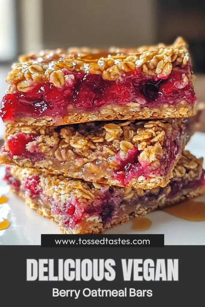 Indulge in these delicious Vegan Berry Oatmeal Bars, a perfect healthy snack recipe for any time of day. These gluten-free oatmeal bars are packed with nutrients and use simple ingredients for easy vegan baking recipes. Enjoy the delightful mix of berries and almond butter in this plant-based dessert bar. Perfect for meal prep or a quick treat! Click to save this recipe and enjoy a guilt-free snack! #VeganBaking #HealthySnacks #GlutenFree #PlantBasedDesserts