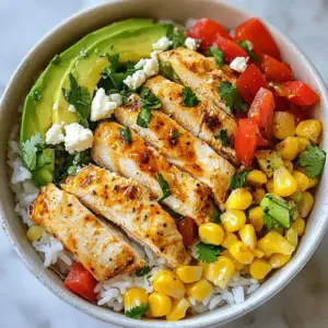 - Chicken and Vegetables - 1 pound chicken breast, diced - 1 cup corn kernels (fresh, frozen, or canned) - 1 red bell pepper, diced - 1/2 cup red onion, finely chopped - 1 avocado, sliced - Spices and Seasoning - 2 tablespoons olive oil - 1 tablespoon chili powder - 1 teaspoon cumin - 1 teaspoon garlic powder - Salt and pepper to taste - Juice of 1 lime - Rice and Toppings - 2 cups cooked jasmine rice - 1/2 cup crumbled feta cheese - 1/4 cup cilantro, chopped This dish combines juicy chicken, sweet corn, and fresh veggies. The spices add a warm kick. Each topping brings a new flavor. This makes every bite a delight. You can mix and match ingredients based on what you have. The avocado adds creaminess, while feta gives a salty touch. Each ingredient works together to create a vibrant meal. Using fresh ingredients boosts flavor. Choose quality chicken and ripe veggies. They make a big difference. Always taste as you go. Adjust the seasoning if needed. This recipe is flexible, so feel free to explore. The key is to enjoy the process and make it your own! {{ingredient_image_1}} Cooking the Chicken in the Skillet To start, take a large skillet and heat one tablespoon of olive oil over medium heat. While the oil warms, dice your chicken breast into small, even pieces. This helps it cook faster. Once the oil is hot, add the chicken to the skillet. Cook the chicken for about 7 to 10 minutes. Stir it often until it turns golden brown and is cooked all the way through. Seasoning Tips for Flavor For great flavor, season the chicken with chili powder, cumin, garlic powder, salt, and pepper before cooking. This mix gives the chicken a nice taste that blends well with other ingredients. Timing for Perfectly Cooked Vegetables After the chicken cooks, remove it from the skillet and set it aside. In the same skillet, add the rest of the olive oil. Toss in the corn and diced red bell pepper. Saut&eacute; these for about 5 minutes. This timing helps the vegetables stay tender yet crisp. Achieving a Slight Char on Corn To get that perfect char, make sure the corn gets a little brown on the edges. This adds an extra layer of flavor, making your dish even more exciting. Mixing Ingredients in a Bowl In a big bowl, combine the cooked jasmine rice, saut&eacute;ed corn, and red bell peppers. Squeeze fresh lime juice over the mix to add brightness. Toss everything well until combined. Layering the Bowl with Toppings Now it&rsquo;s time to assemble your bowl! Divide the rice-corn mix among serving bowls. Top each bowl with the golden chicken, avocado slices, red onion, and crumbled feta cheese. This layering creates a beautiful and tasty meal. Finish by sprinkling fresh cilantro on top for color and flavor. Enjoy your delicious street corn chicken rice bowl! To make this dish sing, use fresh spices. They pack a punch and add depth. Try changing the chili powder. You can mix in smoked paprika for a sweet twist. Fresh lime juice brightens every bite. Don&rsquo;t forget to taste as you go! Fresh ingredients truly matter. Use corn right off the cob if you can. The crunch and sweetness are unmatched. Choose ripe avocados for creaminess. A good avocado makes the bowl special. Crumbled feta adds a salty touch that ties all the flavors together. When cooking chicken, I love using a skillet. It gets a nice sear and cooks quickly. The grill is great too. It adds a smoky flavor that enhances the chicken. Just make sure to watch the heat. You want juicy chicken, not dry. For the rice, use jasmine rice. It&rsquo;s fluffy and fragrant. Rinse it first to remove extra starch. This keeps it from getting gummy. Cook it in a pot with a lid. Follow the water-to-rice ratio on the package for best results. Let it sit after cooking for a few minutes. This makes it perfect for your bowl. Pro Tips Use Fresh Ingredients: Fresh corn and ripe avocados enhance the flavor and texture of your rice bowl. Try to use seasonal produce for the best results. Customize the Spice Level: Adjust the amount of chili powder according to your heat preference. You can also add jalape&ntilde;os for an extra kick! Meal Prep Friendly: This recipe is perfect for meal prep. Cook a larger batch and store in the fridge for quick lunches or dinners throughout the week. Experiment with Toppings: Feel free to mix and match toppings like black beans, diced tomatoes, or even a dollop of sour cream to personalize your bowl. {{image_2}} You can easily change the protein in this dish. If you want a plant-based option, use tofu. Just cube it and saut&eacute; until golden. Shrimp is also a tasty swap. Cook shrimp for about 3-5 minutes until they turn pink. For vegetables, feel free to mix things up. Zucchini adds a nice crunch. Just slice it and saut&eacute; it with the corn. Spinach can also work well. Add it near the end of cooking to keep it bright and fresh. Adding sauces can boost the flavor of your bowl. A drizzle of sriracha gives it a spicy kick. You might also like a creamy avocado dressing. Mix avocado with lime juice and a pinch of salt for a smooth topping. For dressings, consider a simple vinaigrette. Combine olive oil, lime juice, and a bit of honey. This will add a nice sweetness. Another option is a cilantro-lime dressing. Blend cilantro, lime juice, and yogurt for a fresh twist. To keep your Street Corn Chicken Rice Bowl fresh, start with proper storage. - Storing Leftovers in the Refrigerator: Place any leftovers in an airtight container. They will stay good for about 3 to 4 days. Make sure the bowl is cool before sealing it. This helps keep the food fresh. - Freezing Tips for Longer Preservation: If you want to store it longer, freeze the bowl. Use freezer-safe containers or bags. It can last for about 2 to 3 months. Just remember to label the container with the date. This way, you won&rsquo;t forget when you made it. When it&rsquo;s time to enjoy your leftovers, reheating is key. - Best Methods to Reheat without Drying Out: The best way to reheat is in the oven or on the stovetop. Heat to 350&deg;F (175&deg;C) for about 15-20 minutes. If using the stovetop, add a splash of water or broth to keep it moist. Stir occasionally. - Suggestions for Quick Reheating: If you&rsquo;re in a hurry, use the microwave. Place the bowl in the microwave for about 1-2 minutes. Cover it with a damp paper towel. This helps to keep it from drying out. Stir halfway through for even heating. You can use many types of rice. Some good options are: - Basmati rice - Brown rice - White rice Each type has a different flavor and texture. Basmati has a nutty taste. Brown rice is chewy and full of fiber. White rice cooks faster but has less flavor. If you switch rice types, adjust the cooking time. For basmati, cook for about 15 minutes. Brown rice takes longer, around 40 minutes. Follow the package directions for best results. Yes, you can prep this dish ahead of time. Here are some tips: - Cook the chicken and rice in advance. - Chop the veggies and store them in the fridge. - Mix the corn and peppers just before serving for freshness. Keep leftovers in an airtight container. Store them in the fridge for up to four days. For longer storage, freeze the chicken and rice separately. You can thaw them overnight in the fridge before reheating. You can easily convert this dish to vegan. Here are some ideas: Instead of chicken, use tofu or chickpeas. Tofu is great when you season and cook it well. Chickpeas add protein and a nice texture. For the feta cheese, try using vegan cheese or avocado. Both options add creaminess without dairy. You can also skip cheese and add extra veggies for flavor. This blog post provides a clear guide to making a tasty chicken rice bowl. We covered the key ingredients, step-by-step cooking, and helpful tips to enhance flavor. You can also explore variations and storage options to keep your meal fresh. Remember, using fresh ingredients and practicing varied cooking techniques can elevate your dish. So grab your ingredients, have fun cooking, and enjoy your delicious creation!