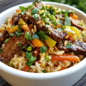 - 2 cups cooked jasmine rice (preferably day-old) - 250g beef sirloin, thinly sliced - 1 bell pepper, diced - 1 carrot, diced - 2 green onions, chopped - 3 cloves garlic, minced - 2 tablespoons soy sauce - 1 tablespoon oyster sauce (optional) - 1 tablespoon chili paste (adjust to taste) - 1 teaspoon sesame oil - 2 tablespoons vegetable oil - Salt and pepper to taste - Fresh cilantro for garnish Using fresh, high-quality ingredients makes all the difference. I prefer day-old jasmine rice because it holds its shape better during cooking. Fresh beef sirloin adds a juicy bite. Bell peppers and carrots bring vibrant colors and crunch. The garlic gives an amazing aroma when saut&eacute;ed. For sauces, soy sauce and chili paste are key for flavor. The oyster sauce adds depth, though it's optional. Sesame oil gives a nutty finish that ties everything together. Don't forget salt and pepper; they enhance all the flavors. Finally, fresh cilantro adds a lovely touch at the end. This combination creates a colorful and tasty meal. Each bite bursts with flavor, making it a dish you&rsquo;ll want to share. {{ingredient_image_1}} First, grab your beef sirloin. Slice it thinly and place it in a bowl. Add a pinch of salt, a dash of pepper, and one tablespoon of soy sauce. Mix it well. Let the beef marinate for 15 minutes. This extra time lets the flavors soak in. Heat a large skillet over medium-high heat. Pour in one tablespoon of vegetable oil. When the oil is hot, add the marinated beef in a single layer. Sear the beef for 2 to 3 minutes until it turns crispy and golden. Remove it from the skillet and set it aside. In the same skillet, add another tablespoon of vegetable oil. Toss in the minced garlic and saut&eacute; it for about 30 seconds until it smells amazing. Next, add the diced bell pepper and carrot to the skillet. Stir-fry these veggies for 3 to 4 minutes. You want them to be tender but still have a nice crunch. Now, it&rsquo;s time to add the cooked jasmine rice to the skillet. Make sure to break up any clumps of rice. Then, pour in the remaining soy sauce, oyster sauce (if using), chili paste, and sesame oil. Toss everything together until the rice is evenly coated with the sauces. Return your crispy beef to the skillet. Mix it well with the rice and veggies. Stir-fry everything together for an additional 2 to 3 minutes. This step allows all the flavors to meld beautifully. Turn off the heat and fold in the chopped green onions. This adds a fresh pop of flavor. Finally, transfer the crispy chili beef fried rice to plates or bowls. It&rsquo;s ready to enjoy! - Use day-old jasmine rice for better texture. Fresh rice can be too sticky. - Ensure rice is well-separated before adding to the skillet. This helps it fry evenly. - You can customize the chili paste to your taste. Start with less for a milder dish. - Balance flavors with additional sauces. Soy sauce or oyster sauce can enhance the taste. - To keep the beef crispy, make sure it cooks in a single layer. This prevents steaming. - Do not overcrowd the skillet. Too much food at once can lower the heat and make food soggy. Pro Tips Use Day-Old Rice: Using day-old jasmine rice is key for achieving that perfect crispy texture. Freshly cooked rice tends to be too moist and clumps together. High Heat for Searing: Ensure your skillet or wok is hot enough before adding the beef. This helps to sear it quickly, locking in the juices and creating a crispy exterior. Customize the Spice Level: Adjust the amount of chili paste to suit your preference. Start with a smaller amount and add more as needed to avoid overpowering the dish. Garnish for Freshness: Don&rsquo;t skip the fresh cilantro and green onions. They add a vibrant flavor and a burst of color that enhances the overall presentation of your dish. {{image_2}} You can swap beef for tofu or tempeh. Both options work great. Tofu absorbs flavors well. Tempeh adds a nutty taste. For extra flavor, add more vegetables. Broccoli, snap peas, or mushrooms are perfect. These veggies will give you color and crunch. If you want a healthier option, try brown rice or quinoa. Brown rice has a nutty flavor and chewier texture. Quinoa cooks faster but needs a little more water. Adjust the cooking time for both. Brown rice takes about 40 minutes, while quinoa cooks in about 15 minutes. Explore different sauces to change the dish&rsquo;s taste. Sweet soy sauce can add a nice twist. Hoisin sauce brings a sweet and savory flavor. You can also try a splash of rice vinegar for tang. Experiment with different combinations to find your favorite. To store your Crispy Chili Beef Fried Rice, let it cool first. Spread it out on a plate to cool faster. Once it's cool, transfer it to an airtight container. You can keep it in the refrigerator for up to three days. When you want to reheat, use a skillet over medium heat. Add a splash of water or soy sauce to keep it moist. Stir frequently to warm it evenly without drying it out. If you want to freeze your fried rice, let it cool completely first. Then, pack it in a freezer-safe bag or container. Remove as much air as possible to prevent freezer burn. This dish can last in the freezer for about three months. To thaw, place it in the fridge overnight. For quick thawing, you can microwave it on low for a few minutes. Crispy Chili Beef Fried Rice generally lasts up to three days in the refrigerator. Signs that it has gone bad include an off smell and changes in color. If you see any mold, throw it away. Always trust your senses when deciding if food is safe to eat. Yes, you can use leftover rice. Day-old rice is best for this dish. Here&rsquo;s why: - Texture: Day-old rice dries out a bit in the fridge. This helps it fry better. - Flavor: Leftover rice absorbs sauces and spices more effectively. - Convenience: Using what you already have saves time and reduces waste. The spice level can vary. This recipe uses chili paste, which adds heat. You can adjust it based on your taste. Here&rsquo;s how: - Less Heat: Use less chili paste or skip it. - More Heat: Add extra chili paste or fresh chili peppers. - Balance: Pair with creamy sides like sour cream to cool the heat. To enhance your meal, consider these sides: - Spring Rolls: These crispy treats add crunch. - Steamed Broccoli: A healthy side that pairs well. - Egg Rolls: Add protein and flavor. - Cucumber Salad: A fresh and crunchy contrast. Yes, this recipe is great for meal prep. Here are some tips: - Make Ahead: Cook the fried rice and let it cool. - Portion: Divide into containers for easy meals later. - Store: Keep in the fridge for up to four days. - Reheat: Warm in the microwave or on the stove, adding a splash of water to keep it moist. This blog post shared a simple yet delicious recipe for Crispy Chili Beef Fried Rice. You learned about key ingredients, step-by-step cooking instructions, and helpful tips. Remember to use day-old rice for the best texture and feel free to adjust spice levels. You can also make variations to fit your taste, such as using tofu for a vegetarian option. Store any leftovers properly for future meals. Cooking should be fun and creative, so enjoy making this dish your own!