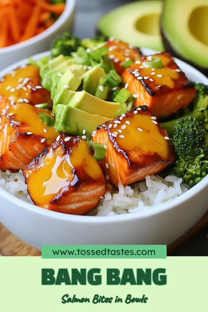 Discover the deliciousness of Bang Bang Salmon Bites Bowls! This healthy salmon dinner features tender salmon cubes sautéed to perfection, drizzled with creamy sweet chili sauce salmon for a burst of flavor. Enjoy this Asian-inspired salmon recipe that's easy to make and perfect for weeknight meals. Ready to assemble your own mouthwatering Salmon Bowl Recipe? Save this recipe now and get cooking! #BangBangSalmonBites #HealthyDinner #SalmonRecipe #AsianInspiredCooking