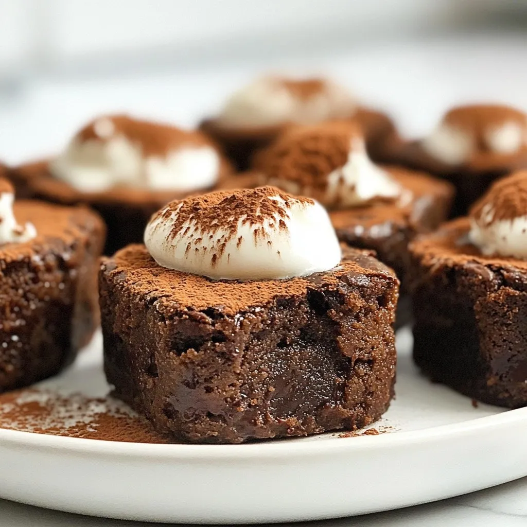 - 1 cup almond flour - 1/2 cup unsweetened cocoa powder - 1/2 cup chocolate-flavored protein powder - 1/2 cup honey or maple syrup - 1/4 cup melted coconut oil - 2 large eggs - 1 teaspoon vanilla extract - 1/2 teaspoon baking powder - Pinch of salt - 1/2 cup optional dark chocolate chips These ingredients create the perfect blend for Chocolate Protein Brownie Bites. Almond flour gives them a rich, nutty flavor. Cocoa powder adds a deep chocolate taste. The chocolate-flavored protein powder boosts the protein content, making these bites great for snacks after workouts. Honey or maple syrup serves as a natural sweetener. Both options add a lovely sweetness without refined sugar. The melted coconut oil keeps the brownie bites moist while adding healthy fats. Eggs help bind everything together and add structure. Vanilla extract brings a warm flavor that enhances the chocolate. Baking powder makes them rise, resulting in a light texture. A pinch of salt balances the sweetness and intensifies the chocolate flavor. Dark chocolate chips, while optional, add extra richness and a melty surprise in every bite. Gather these ingredients, and you’re ready to create a tasty, healthy treat! {{ingredient_image_1}} - Preheat oven to 350°F (175°C). - Prepare mini muffin tin with liners or grease. Start by preheating your oven. This helps the brownie bites bake evenly. Next, grab your mini muffin tin. You can use paper liners or grease it lightly with oil. This step helps the bites release easily after baking. - Combine almond flour, cocoa powder, protein powder, baking powder, and salt. In a large bowl, add the dry ingredients. Start with almond flour, then add cocoa powder, protein powder, baking powder, and a pinch of salt. Mix everything until it looks even. A good mix ensures your brownie bites have a consistent flavor. - Whisk honey (or maple syrup), melted coconut oil, eggs, and vanilla extract. In a separate bowl, whisk your wet ingredients. Start with honey or maple syrup for sweetness. Then add melted coconut oil for richness. Crack in the eggs and pour in the vanilla extract. Whisk until smooth. This mix adds moisture to the brownie bites. - Mix wet and dry ingredients. - Optionally fold in dark chocolate chips. Now, pour your wet mix into the dry ingredients. Stir gently until just combined. Be careful not to overmix. If you love chocolate, fold in dark chocolate chips. They add extra flavor and texture to your bites. - Fill muffin tin and bake for 12-15 minutes. - Cooling instructions. Scoop the batter into the prepared muffin tin. Fill each cup about 3/4 full. Bake in the preheated oven for 12-15 minutes. To check if they are done, insert a toothpick into the center. If it comes out clean, they are ready. Let the brownie bites cool in the pan for 5 minutes. Then, transfer them to a wire rack to cool completely. Enjoy your simple and tasty treats! To check if your brownie bites are done, use a toothpick. Insert it into the center of a brownie bite. If it comes out clean, they are ready. If it has wet batter, bake for a few more minutes. This simple test keeps your bites moist and chewy. Mixing can affect the texture. Avoid overmixing the batter. Stir until just combined. If you see dry flour, stop mixing. Overmixing can lead to tough brownie bites. You want them to be soft and fudgy. For a beautiful display, arrange the brownie bites on a decorative plate. You can stack them for height or lay them flat. This makes your treat look inviting and fun. To add flair, dust the tops with cocoa powder. This gives a rich look. Alternatively, top with a small dollop of Greek yogurt. The creamy contrast works well with the chocolate. Almond flour is a great choice. It is lower in carbs than regular flour. It also adds healthy fats and protein. This helps you feel full longer. Using protein powder boosts the nutrition. It supports muscle repair and keeps energy high. A chocolate-flavored option adds a rich taste without extra sugar. Honey or maple syrup are natural sweeteners. They offer vitamins and minerals. They also keep the brownie bites moist. These sweeteners are better choices than refined sugars. Pro Tips Use Room Temperature Ingredients: Allow eggs and coconut oil to reach room temperature before mixing. This helps create a smoother batter and improves texture. Don’t Overmix: Mix the batter until just combined to keep the brownie bites soft and chewy. Overmixing can result in a denser texture. Store Properly: Keep your brownie bites in an airtight container at room temperature for up to 5 days or refrigerate for longer freshness. Experiment with Flavors: Feel free to add nuts, dried fruit, or spices like cinnamon to customize your brownie bites and enhance their flavor profile. {{image_2}} You can easily change the flavor of these brownie bites. Adding nuts or seeds gives them a nice crunch. Try using walnuts, pecans, or chia seeds. Each adds a unique texture and taste. You can also experiment with different flavored protein powders. Vanilla or peanut butter flavors work great. This small change can make a big difference in taste. If you want a vegan version, swap the eggs for flax eggs. To make a flax egg, mix one tablespoon of flaxseed meal with three tablespoons of water. Let it sit for a few minutes until it thickens. For honey, use maple syrup or agave nectar. Both keep the sweetness while making your bites vegan. These swaps do not change the brownie bites' texture much. To keep these brownie bites gluten-free, use almond flour, which is already gluten-free. You can also use oat flour or coconut flour as alternatives. Just ensure that the flour you select is certified gluten-free. This helps you avoid any gluten cross-contamination. Always check the labels on your ingredients to be safe. These options allow everyone to enjoy these treats without worry. Store your brownie bites in an airtight container. Keep them in the fridge for the best flavor. They stay fresh and moist this way. If you want to keep them longer, you can freeze them. Just wrap each bite in plastic wrap, then place them in a freezer bag. This helps prevent freezer burn. These brownie bites last about one week in the fridge. If you freeze them, they can last up to three months. Just make sure to label your bag with the date. This way, you know when to enjoy them! To warm up brownie bites, use the microwave. Heat them in short bursts of 10-15 seconds. This helps keep them soft. You can also use the oven. Preheat it to 300°F (150°C) and warm them for about 5-7 minutes. Both methods keep your bites tasty and moist. Yes, you can. Almond flour is great, but you can try oat flour or coconut flour. They can change the taste and texture a bit. Just note that coconut flour absorbs more liquid, so you might need to adjust the wet ingredients. To make these brownie bites vegan, replace the eggs with flax eggs. Mix one tablespoon of flaxseed meal with three tablespoons of water for each egg. You can also use maple syrup instead of honey for a fully vegan treat. To cut down on sugar, use less honey or maple syrup. You can also use unsweetened applesauce. It will add moisture and a hint of sweetness without being too sugary. Absolutely! You can use stevia or monk fruit sweetener. These are lower in calories and still sweet. Just make sure to check the conversion rates, as they can differ from honey or maple syrup. Each brownie bite has about 80 calories, 4g protein, 5g fat, and 6g carbs. They are a good source of protein and healthy fats, making them a satisfying snack! You now know how to make delicious brownie bites with simple ingredients. We covered each step, from mixing the dry and wet ingredients to baking them perfectly. Remember, you can be creative with flavors and variations while keeping health in mind. These bites are easy to store and reheat, making them a great treat any time. Enjoy your tasty creation and feel good about the healthy choices you made!