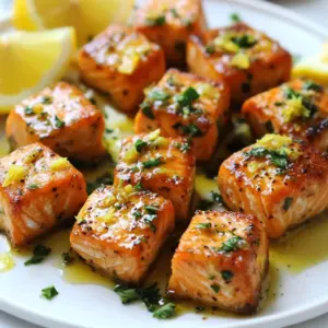- 1 lb salmon fillet, skinless and cut into 1-inch cubes - 3 tablespoons unsalted butter - 4 cloves garlic, minced - Juice and zest of 1 lemon - 1 tablespoon fresh parsley, chopped (plus more for garnish) - Salt and pepper to taste Lemon garlic butter salmon bites are simple yet packed with flavor. The salmon fillet is the star here. I use skinless fillets. They cook evenly and soak up all the butter and garlic goodness. Next, I grab unsalted butter. It gives me control over the salt level. Garlic adds a rich aroma and taste. I use four cloves, minced well. Fresh lemon juice and zest brighten the dish. They add a refreshing zing that pairs perfectly with the salmon. Fresh parsley brings a pop of color and flavor. Finally, I season with salt and pepper to enhance all the tastes. - Additional herbs for flavor - Spices for seasoning - Side dishes for serving While the main ingredients shine, I sometimes add optional herbs. Dill or thyme can add a nice touch. Spices like paprika or cumin can give it a twist. For sides, try rice or a salad. They balance the meal and make it hearty. Feel free to get creative! {{ingredient_image_1}} - First, rinse the salmon under cold water. This gets rid of any unwanted bits. - Next, pat the salmon dry with paper towels. This helps it sear nicely. - Now, cut the salmon fillet into 1-inch cubes. Try to make them even for best cooking. - Finally, season the salmon pieces with salt and pepper. This adds flavor right from the start. - In a large skillet, melt 3 tablespoons of unsalted butter over medium heat. The butter gives a rich taste. - Once the butter melts, add 4 cloves of minced garlic. Saut&eacute; for 1-2 minutes until fragrant. Be careful not to burn the garlic, as burnt garlic tastes bitter. - Increase the heat to medium-high. Add the seasoned salmon cubes to the skillet. - Let the salmon cook for about 2-3 minutes on one side. It should turn golden brown. - Carefully flip the salmon bites over. Reduce the heat back to medium. - Squeeze the juice of 1 lemon over the salmon pieces. Add the zest and sprinkle with chopped parsley. - Cook for another 2-3 minutes until the salmon is cooked through but still tender. - Once done, remove from heat and let sit for a minute. This helps the flavors set. - Garnish with extra parsley and serve with lemon wedges on the side. This adds a fresh touch. To avoid overcooking salmon bites, watch the time closely. Cook them for 2-3 minutes on each side. You want them golden brown, but still tender inside. Use a meat thermometer for best results. The internal temperature should reach 145&deg;F. Even seasoning is key for flavor. Start by generously salting and peppering the salmon cubes before cooking. This helps each bite taste great. Stir the garlic in the butter well, so it coats all the salmon. For side dishes, consider simple options. Steamed veggies, rice, or a fresh salad work well. These sides offer balance and keep things light. Feel free to mix and match based on your taste. Garnishing can be fun. Sprinkle extra parsley over the salmon. Serve lemon wedges on the side for a zesty touch. This adds color and brightens each bite. When it comes to drinks, white wine pairs nicely. A crisp Sauvignon Blanc or Chardonnay complements the salmon. For a non-alcoholic option, try sparkling water with lemon. To enhance the dish, think about adding fresh herbs. Dill or cilantro can bring a new twist. A dash of red pepper flakes gives a bit of heat, too. These small choices make a big difference in flavor. Pro Tips Fresh Salmon is Key: Always use the freshest salmon you can find for the best flavor and texture. Look for bright, firm fillets without any off smell. Perfectly Sear the Salmon: Make sure your skillet is hot before adding the salmon. This ensures a nice golden crust while keeping the inside tender. Don&rsquo;t Overcook: Salmon cooks quickly, so keep an eye on it. Remove it from the heat as soon as it flakes easily with a fork for the best results. Garnish for Presentation: A sprinkle of fresh parsley not only adds color but also enhances the dish&rsquo;s flavor. Consider adding lemon zest as a garnish for extra brightness. {{image_2}} You can swap salmon for other fish like cod or halibut. Both have a mild taste. They cook in a similar way, so you can follow the same recipe. For a fun twist, try shrimp. Just adjust the cooking time, as shrimp cooks faster. If you're looking for vegetarian options, consider using tofu. Firm tofu absorbs flavors well. Cut it into cubes, just like the salmon. Cook it the same way for tasty bites. Another option is chickpeas. Toss them in the garlic butter for a hearty, plant-based twist. You can add different citrus for a fresh kick. Try lime or orange juice. They brighten the dish while keeping it zesty. For a unique twist, use grapefruit juice. It offers a slight bitterness that balances well with the butter. Spices and herbs can change the flavor profile too. Add smoked paprika for a warm, smoky taste. Fresh dill or basil gives a nice herbal note. Don't be afraid to experiment with your favorite spices. Each mix can create a whole new dish. You can bake these salmon bites in the oven for a hands-off approach. Preheat your oven to 400&deg;F. Place the seasoned salmon in a baking dish. Drizzle with lemon juice and melted butter. Bake for about 10-12 minutes. This method keeps the fish tender and juicy. Grilling is another fun option. Preheat your grill and oil the grates. Skewer the salmon cubes for easy flipping. Grill each side for about 3-4 minutes. This gives a nice char and smoky flavor that is hard to beat. To store leftover salmon bites, place them in an airtight container. This keeps them fresh. You can store them in the fridge for up to three days. Make sure they cool to room temperature before sealing. If you leave them out too long, they can spoil quickly. To reheat salmon bites, use a skillet on low heat. This method helps maintain the texture. Heat them for about 3-5 minutes, flipping gently. You can also use the microwave, but be careful. Heat in short bursts to avoid drying them out. Yes, you can freeze salmon bites. Place them in a freezer-safe bag, removing as much air as possible. They can last for about three months in the freezer. When you are ready to eat, thaw them in the fridge overnight. This keeps them moist and tasty. To check if salmon is cooked, look for its color and texture. Properly cooked salmon should be opaque and easily flake with a fork. The center should be slightly translucent, but not raw. If it feels firm and moist, you are good to go. - Checking for doneness: Use a fork to gently press the salmon. If it flakes easily, it is ready. A food thermometer can also help; aim for 145&deg;F (63&deg;C) for safe eating. - Signs of properly cooked salmon: Look for a light pink color, a flaky texture, and a firm surface. If it looks dull or is falling apart, it may be overcooked. Yes, you can prepare lemon garlic butter salmon bites in advance. This makes meal prep easy and fun. - Preparation tips for meal prep: Cut the salmon into cubes and season them. Store them in an airtight container in the fridge. You can also mix the garlic and butter in advance. Just heat and cook when you&rsquo;re ready to eat. Lemon garlic butter salmon bites pair well with many tasty sides. - Complementary side dishes and salads: Consider serving them with a fresh green salad or roasted vegetables. Rice or quinoa also makes a great base. For a lighter option, serve with steamed asparagus or broccoli. A lemon wedge adds a nice touch! This article focused on making delicious lemon garlic butter salmon bites. You learned about key ingredients, step-by-step cooking instructions, and helpful tips. I shared ways to enhance flavor, serve, and store leftovers. With a few easy steps, you can create a tasty dish that impresses. Experiment with protein and flavor variations to suit your taste. Enjoy these bites with your favorite sides for a complete meal. Now, it&rsquo;s time to have fun in the kitchen!