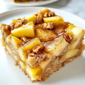 - 2 cups rolled oats - 1 cup unsweetened applesauce - 1/2 cup almond butter (or peanut butter) These main ingredients form the heart of your breakfast bars. The rolled oats give them a chewy texture. Applesauce adds natural sweetness and moisture. Almond butter or peanut butter brings richness and healthy fats. - 1 large apple, peeled and diced (preferably Granny Smith) - 1/3 cup honey or maple syrup - 1 teaspoon vanilla extract - 1 teaspoon ground cinnamon These flavorings boost taste and aroma. Diced apples offer a fresh crunch. Honey or maple syrup enhances sweetness naturally. Vanilla extract and ground cinnamon add warmth and depth to every bite. - 1/2 cup chopped nuts (walnuts or pecans) - 1/2 cup raisins or dried cranberries You can mix in nuts for extra protein and crunch. Dried fruit adds a chewy, sweet touch. Feel free to customize these add-ins to suit your taste! {{ingredient_image_1}} 1. Preheat your oven to 350&deg;F (175&deg;C). 2. Line an 8x8 inch baking pan with parchment paper. This helps when you remove the bars later. If you don&rsquo;t have parchment, grease the pan lightly. 3. In a large bowl, mix 2 cups of rolled oats, 1/2 teaspoon of baking powder, 1 teaspoon of ground cinnamon, and 1/4 teaspoon of salt. Make sure to stir well. 4. In another bowl, combine 1 cup of unsweetened applesauce, 1/2 cup of almond butter, 1/3 cup of honey (or maple syrup), and 1 teaspoon of vanilla extract. Stir until smooth. 1. Add the wet mixture to the dry ingredients. Stir until just mixed. 2. Now it&rsquo;s time to fold in the diced apple. Use one large apple, peeled and diced. Add 1/2 cup of chopped nuts, like walnuts or pecans. You can also add 1/2 cup of raisins or dried cranberries if you like. 3. Pour this mixture into your prepared baking pan. Press it down evenly with your hands. This helps the bars hold together when baked. 1. Place the pan in the preheated oven. Bake for 25-30 minutes. Check when the edges turn golden brown. 2. When done, remove the pan from the oven. Let it cool in the pan for about 10 minutes. 3. After cooling, transfer the bars to a wire rack to cool completely. Once cool, slice them into bars. Enjoy your tasty breakfast bars! Measuring ingredients is key to getting the right texture. Use a kitchen scale for accuracy. If you want chewy bars, stick to the recipe. If you prefer crunchy bars, bake them a bit longer. You can also reduce the applesauce slightly for a firmer bite. To add depth, try spices like nutmeg or ginger. A few drops of almond extract can also boost flavor. Fresh apples give a juicy bite, while dried fruits add chewy sweetness. Experiment with both to find your favorite. Presentation matters! Serve the bars on a nice plate. You can dust them with cinnamon or drizzle honey on top. For a complete breakfast, pair the bars with yogurt or a smoothie. This adds creaminess and extra flavor. Pro Tips Use Fresh Apples: For the best flavor and texture, opt for Granny Smith apples which provide a nice tartness that balances well with the sweetness of the bars. Adjust Sweetness: Depending on your preference, feel free to reduce the amount of honey or maple syrup for a less sweet bar, or add more for a sweeter treat. Mix-ins Variety: Experiment with different nuts or dried fruits to personalize your breakfast bars &ndash; try adding chocolate chips or coconut for a fun twist. Storage Tips: Keep the bars in an airtight container in the fridge for up to a week, or freeze them for longer storage &ndash; they make a great grab-and-go option! {{image_2}} You can switch up the nut butter. Try using cashew or sunflower seed butter. Each adds its own unique taste. You can also change the sweetener. Agave syrup or stevia work great as alternatives. These swaps keep the bars tasty and cater to different diets. Want to change the flavor? Adding spices like nutmeg or cloves gives a warm kick. You can also mix in other fruits. Bananas or berries add sweetness and extra nutrition. This makes each bite a little surprise. For gluten-free bars, use certified gluten-free oats. This small change keeps the base safe for those with gluten issues. If you need vegan bars, replace honey with maple syrup. This simple swap keeps the bars delicious and plant-based. These options ensure everyone enjoys a tasty breakfast! To keep your Chewy Apple Cinnamon Breakfast Bars fresh, store them in an airtight container. This helps prevent moisture and keeps them chewy. At room temperature, they stay good for about a week. If you want them to last longer, consider refrigerating them. For long-term storage, you can freeze these bars. Wrap each bar tightly in plastic wrap or foil. Place the wrapped bars in a freezer bag. They can last up to three months in the freezer. When you want to eat one, remove it from the freezer. Let it thaw in the fridge overnight. To reheat, pop it in the microwave for a few seconds. Check your bars for signs of spoilage. If they smell off or have mold, toss them out. Also, if they feel too hard or dry, they may not taste good. To extend shelf life, keep them in a cool, dark place and avoid direct sunlight. Yes, you can make these bars ahead of time. They store well in an airtight container. Keep them at room temperature for about three days. For longer storage, place them in the fridge for up to a week. You can also freeze them for up to three months. To reheat, just pop them in the microwave for 15-20 seconds. This keeps them soft and chewy. These bars are packed with good ingredients. They have oats, which give you fiber. Fiber helps keep you full longer. Apples add vitamins like A and C. Cinnamon can help regulate blood sugar levels. Almond butter gives healthy fats and protein. This mix provides energy to start your day right. You can change up the ingredients easily. If you don&rsquo;t like almond butter, use peanut or cashew butter. For sweeteners, swap honey for agave syrup or maple syrup. You can add spices like nutmeg for more flavor. Want more texture? Toss in some seeds or swap the nuts for your favorites. You learned how to make chewy apple cinnamon breakfast bars from start to finish. We covered key ingredients, step-by-step instructions, and useful tips. You can personalize the recipe with your favorite fruit and spices. I shared how to store them for freshness and answered common questions. Enjoy experimenting with different flavors and textures. These bars are a tasty way to start your day. Happy baking!